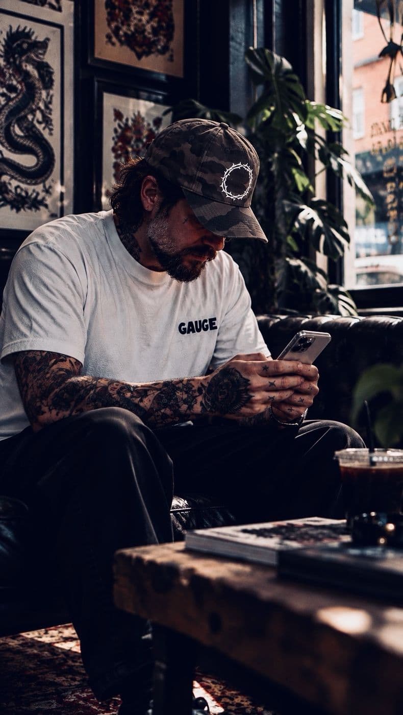 An artist on the studio couch with the phone